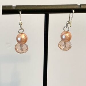 Pink bead and faux crystal earrings on silver hanger.